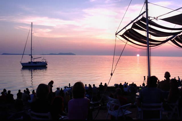 Watch the sunset at Cafe Del Mar.