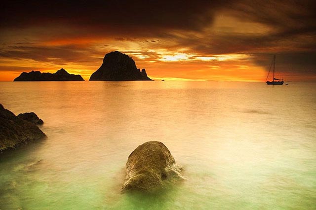 Visit Cala D'Hort to see the famous rock of Es Vedra.